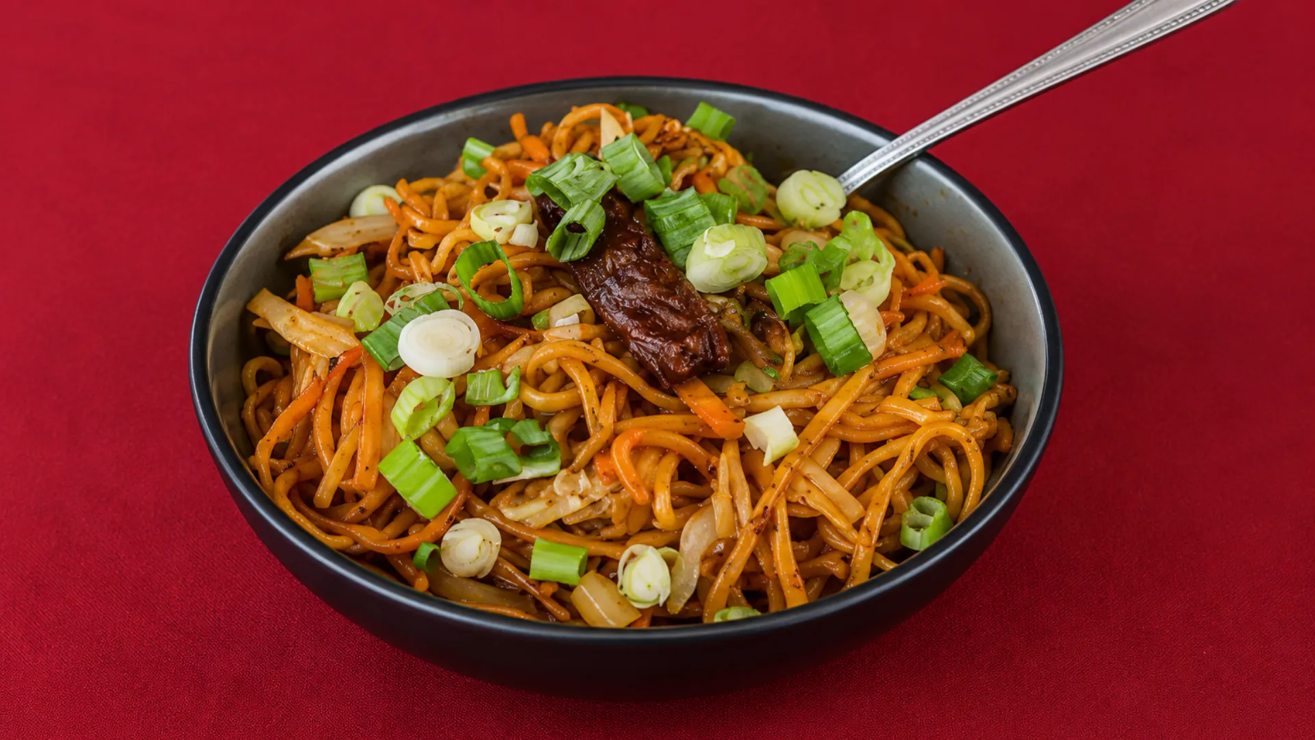 Wok tossed Hakka noodles with spring onion at Delhi Palace Brantford