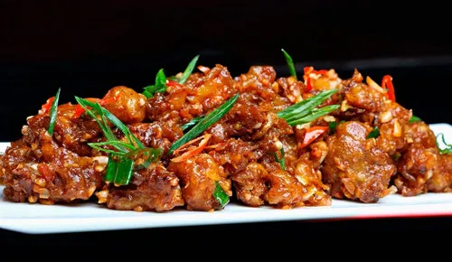 Chicken chilli dry tossed in chilli garlic sauce at Delhi Palace Brantford