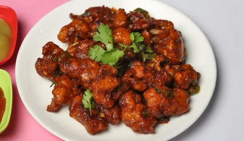 Crispy honey chilli cauliflower Hakka appetizer at Delhi Palace Brantford