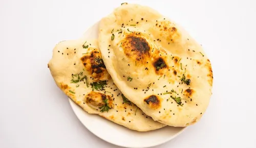Fresh garlic naan from the tandoor at Delhi Palace Brantford