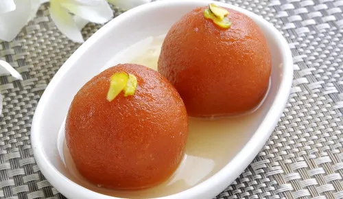 Gulab jamun in rose scented syrup at Delhi Palace Brantford