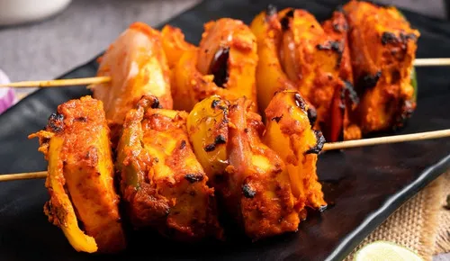 Paneer tikka skewers grilled in the tandoor at Delhi Palace Brantford