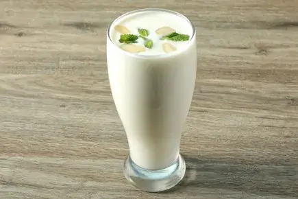 A tall glass of lassi